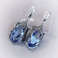 Jianjie Elegant Women's Light Blue Oval Zircon Earrings Ethnic Style Retro Silver Carving Banquet Classic New Ear Jewelry Trend
